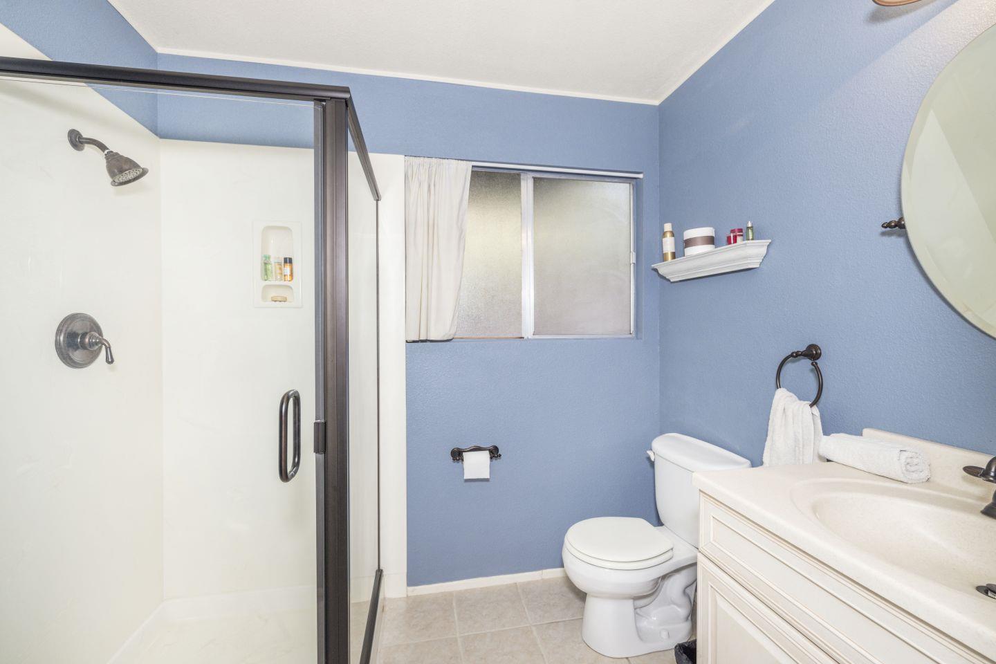 27975 Edgecliff Way Hayward, CA 94542 - Photo 40 of 58 a white toilet sitting next to a bathroom sink