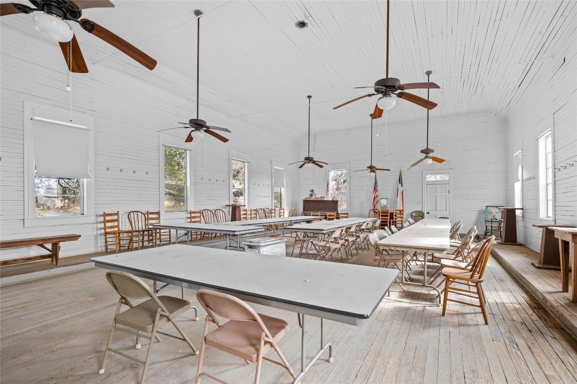 0 North 3rd Street Muldoon, TX 78949 - Photo 6 of 15 a view of a dining room and livingroom with furniture wooden floor a chandelier