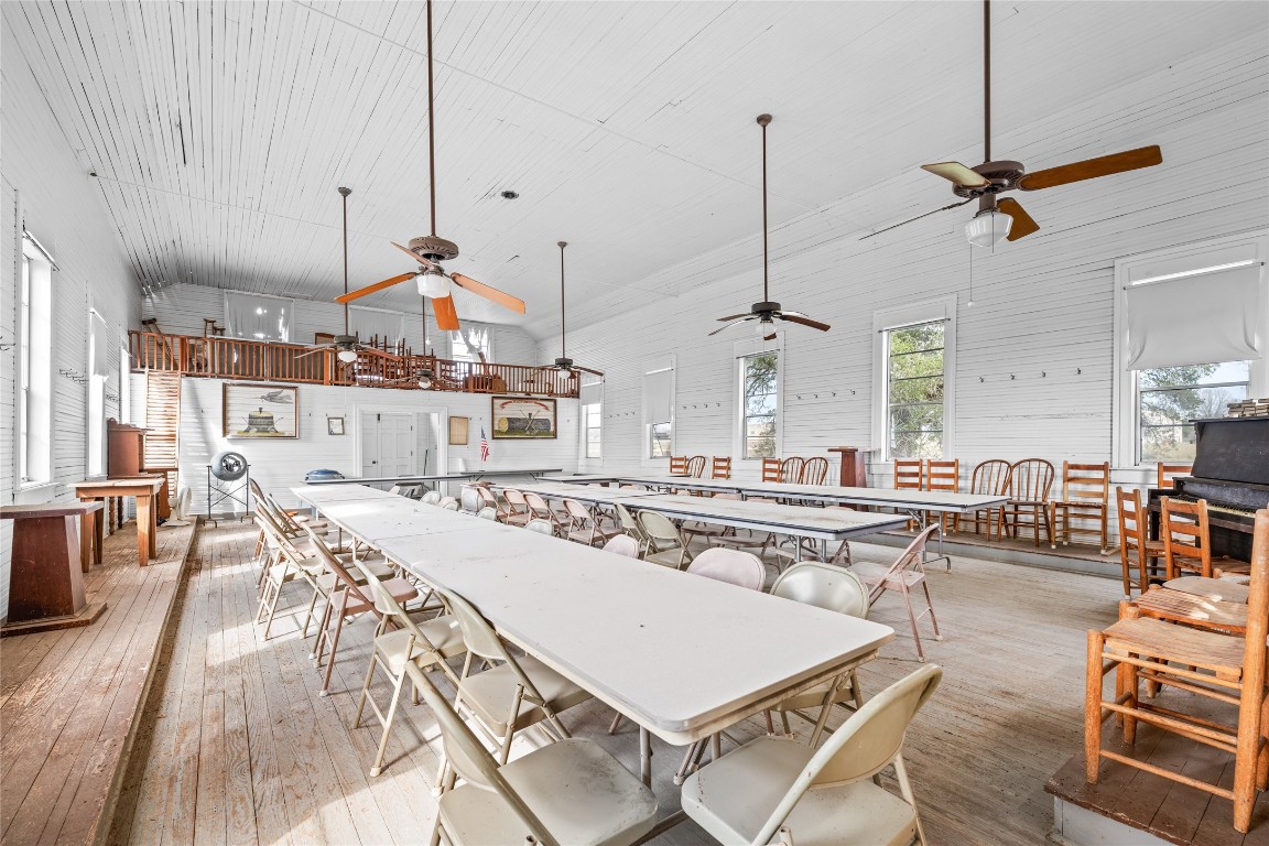 0 North 3rd Street Muldoon, TX 78949 - Photo 7 of 15 a view of a dining room and livingroom with furniture wooden floor a chandelier