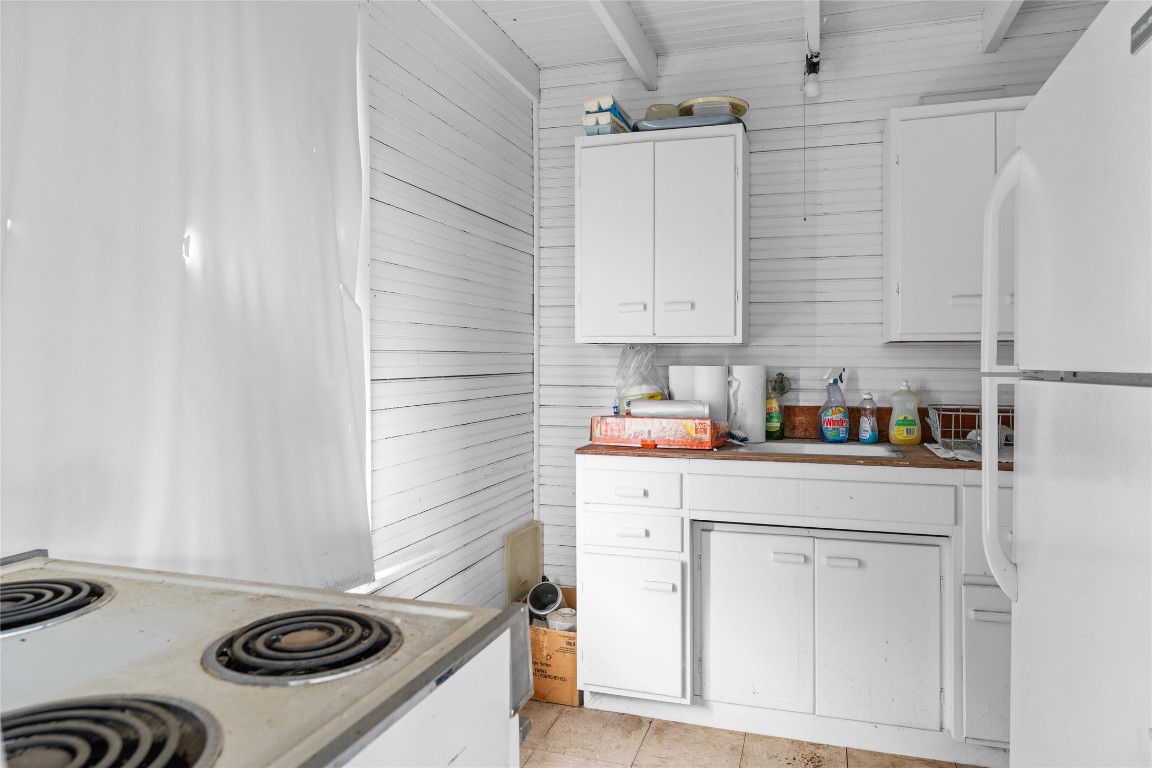 0 North 3rd Street Muldoon, TX 78949 - Photo 9 of 15 a kitchen with granite countertop white cabinets and white appliances