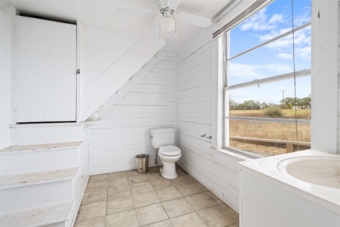 0 North 3rd Street Muldoon, TX 78949 - Photo 10 of 15 a bathroom with a granite countertop sink a toilet and a shower