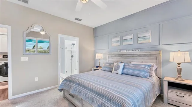 a spacious bathroom with double sink and a mirror