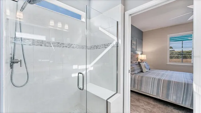 a bedroom with a large bed and a window