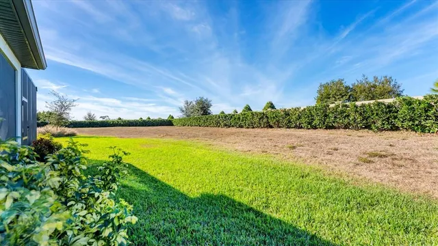 an aerial view of residential houses with outdoor space and swimming pool