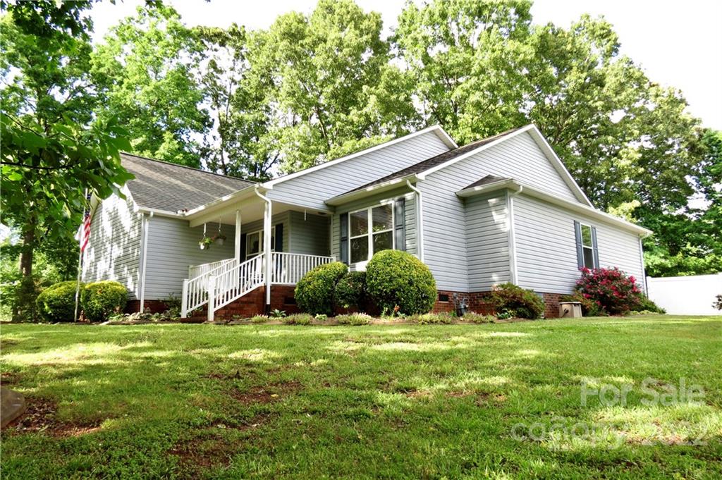 383 Maple Ridge Circle Salisbury, NC 28147 - Photo 1 of 36 a view of a house with a yard and large tree