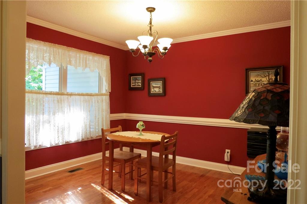 383 Maple Ridge Circle Salisbury, NC 28147 - Photo 9 of 36 a view of a dining room with furniture and chandelier