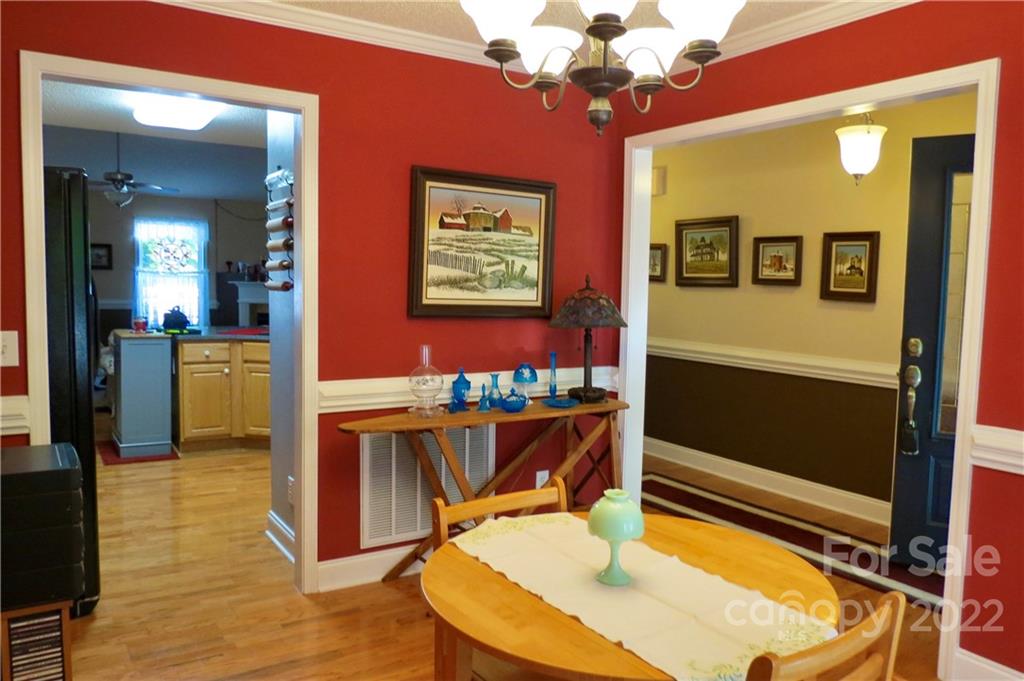 383 Maple Ridge Circle Salisbury, NC 28147 - Photo 10 of 36 a view of a dining room with furniture and a chandelier