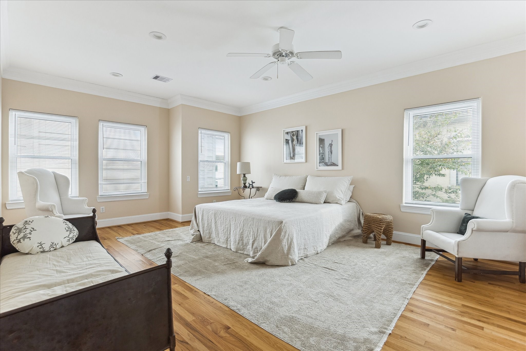 3515 Yupon Street Houston, TX 77006 - Photo 17 of 41 a spacious bedroom with a large bed and a window