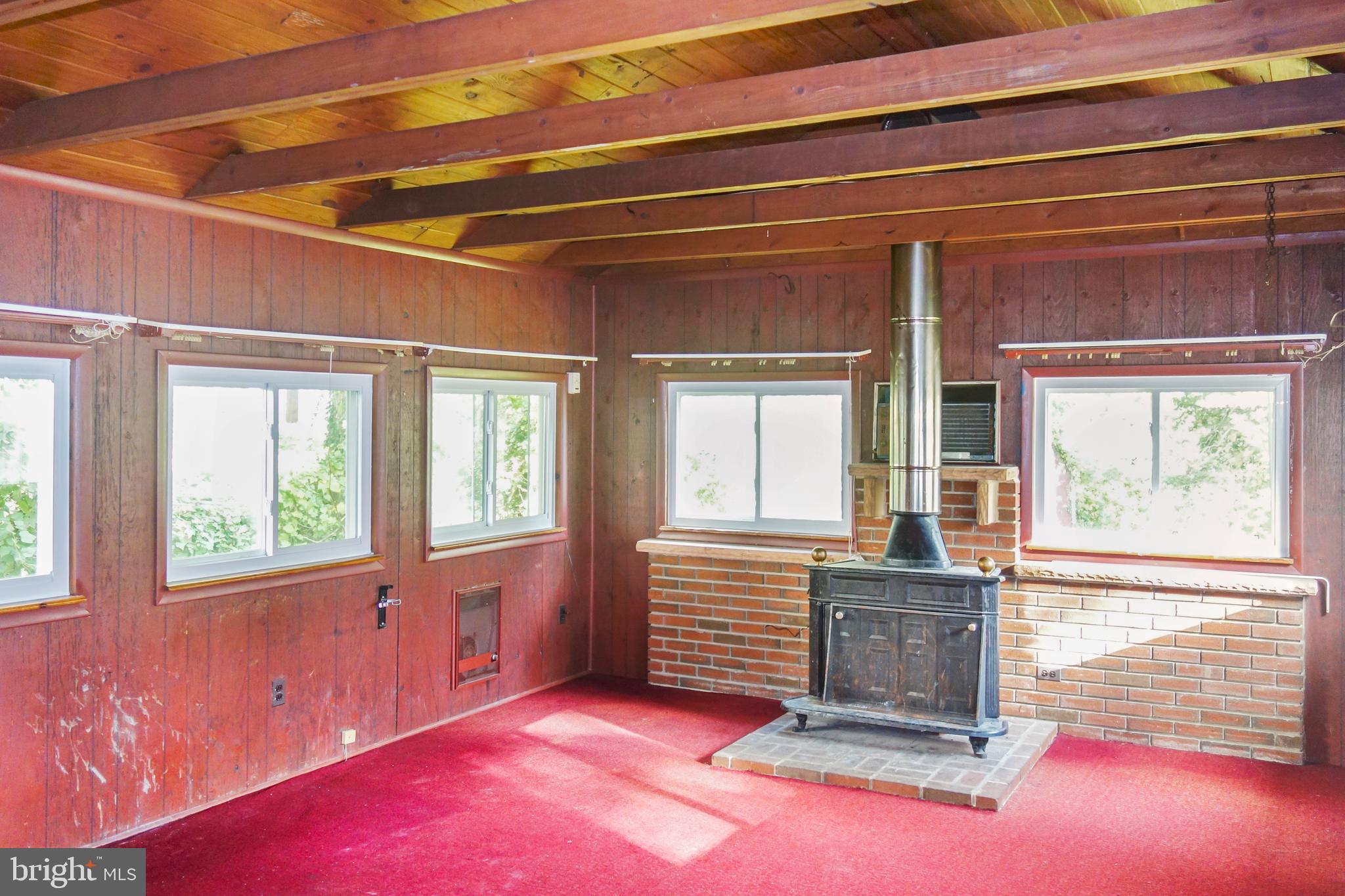 5627 Huntsmoor Road Halethorpe, MD 21227 - Photo 8 of 21 1st floor family room with woodburning fireplace