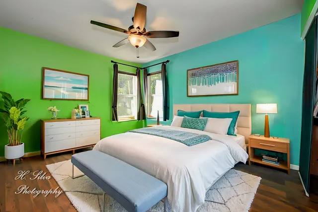 a bedroom with a bed and a window