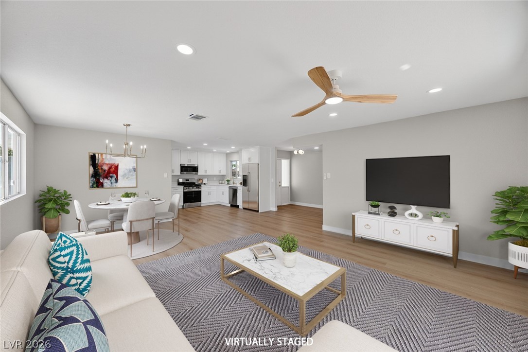 2484 Anglia Street Las Vegas, NV 89142 - Photo 1 of 20 Bright and open concept living with modern finishes and seamless flow.