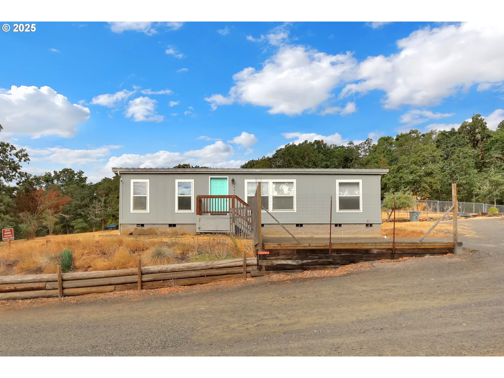 a view of a yard and front view of a house