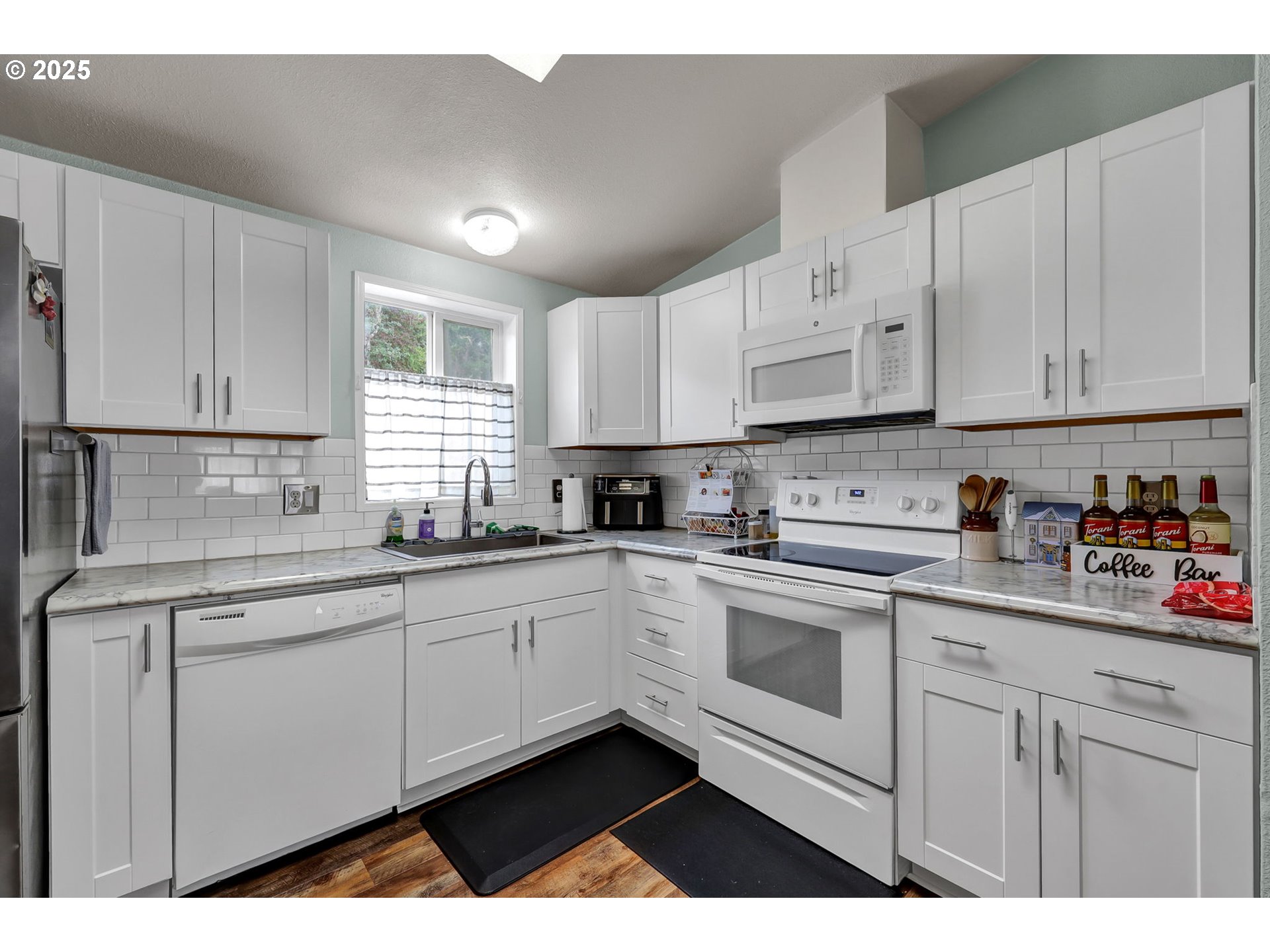 991 Main Street Monroe, OR 97456 - Photo 11 of 48 a kitchen with stainless steel appliances granite countertop a sink and cabinets