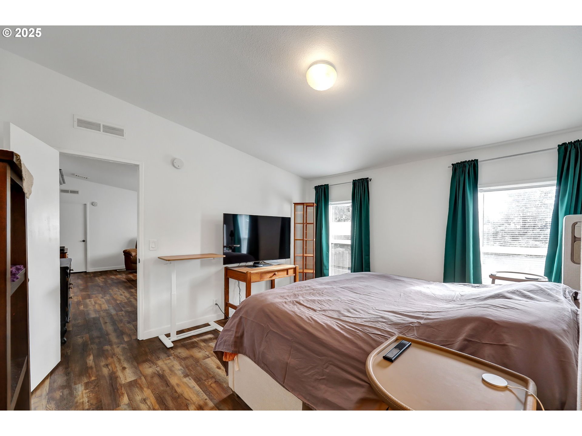 991 Main Street Monroe, OR 97456 - Photo 19 of 48 a bedroom with a bed and a flat screen tv