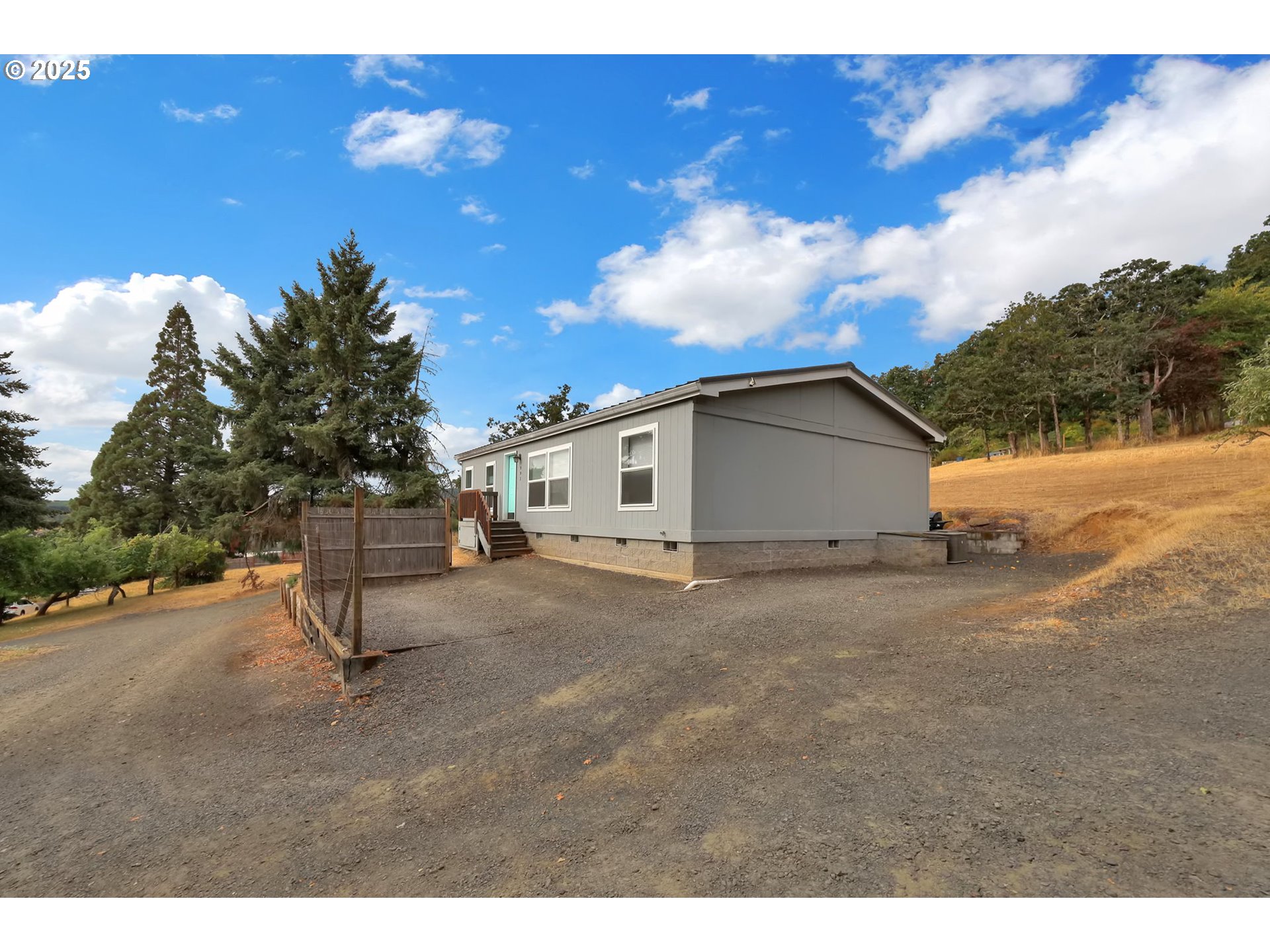 991 Main Street Monroe, OR 97456 - Photo 2 of 48 a view of a house with backyard and a tree