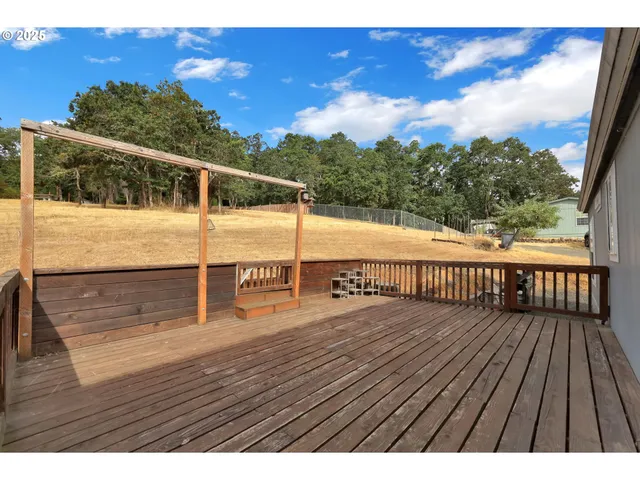 a view of balcony with wooden floor