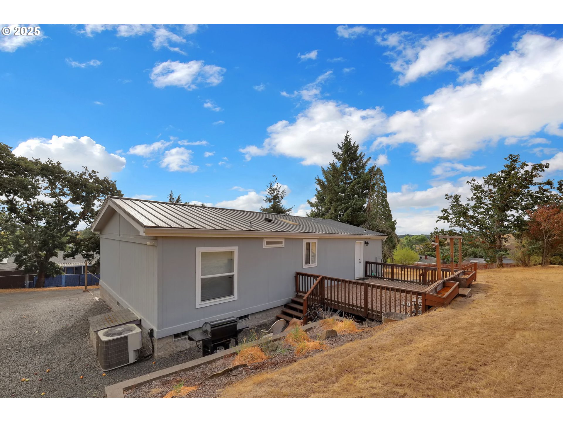991 Main Street Monroe, OR 97456 - Photo 32 of 48 a view of a backyard with couches and a fire pit