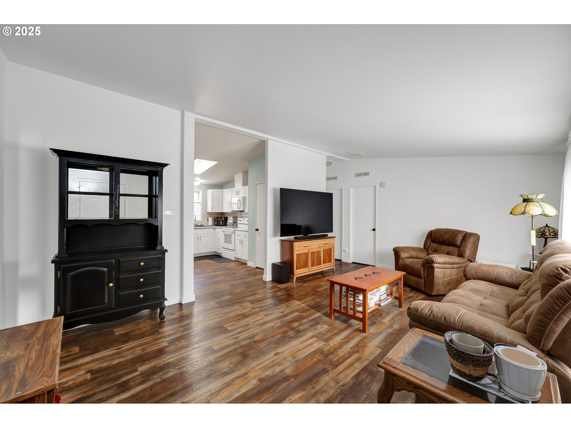 991 Main Street Monroe, OR 97456 - Photo 35 of 48 a living room with furniture and a flat screen tv