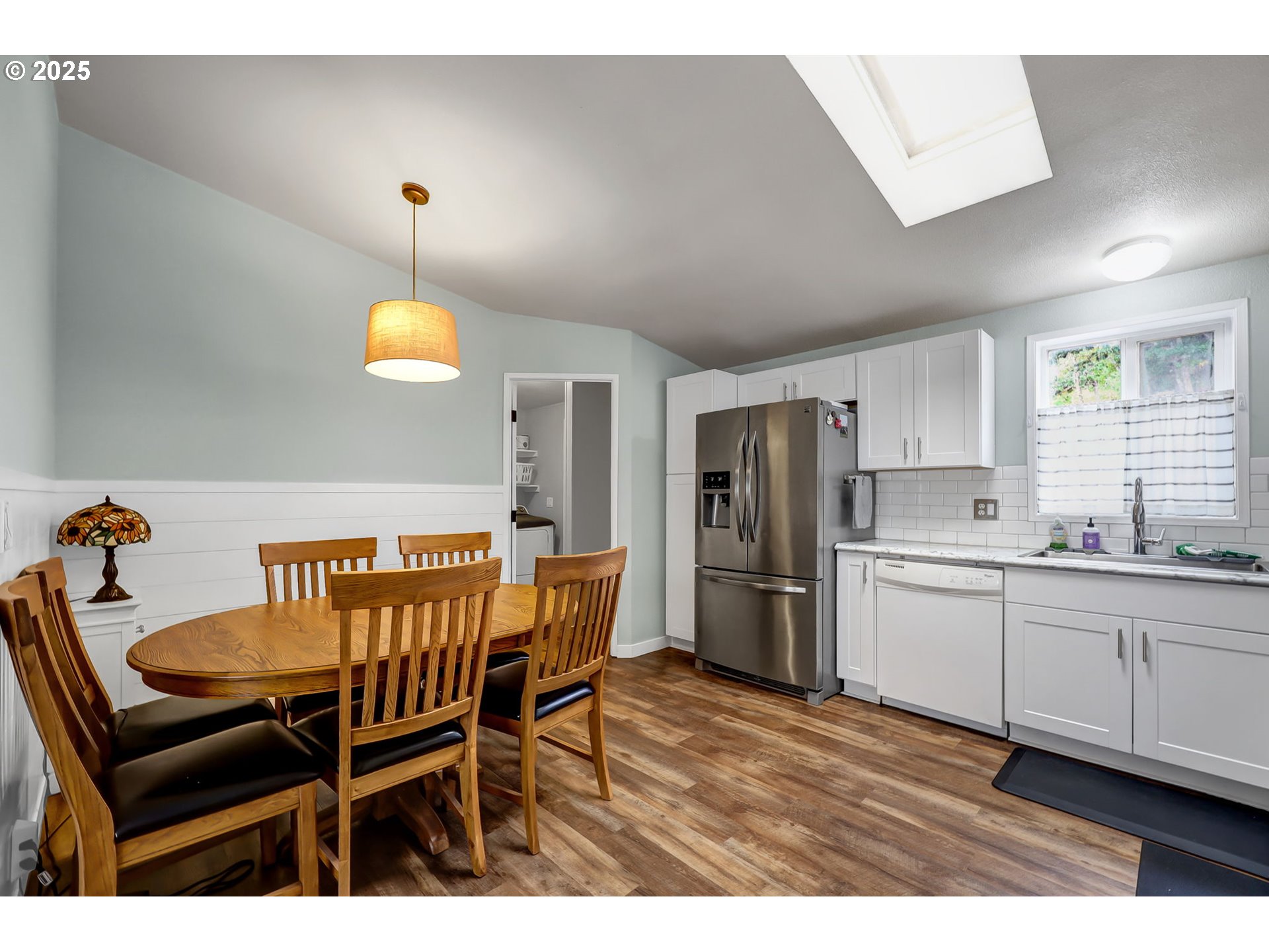 991 Main Street Monroe, OR 97456 - Photo 8 of 48 a kitchen with a dining table chairs and refrigerator