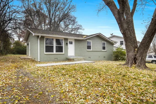 a house with trees in front of it