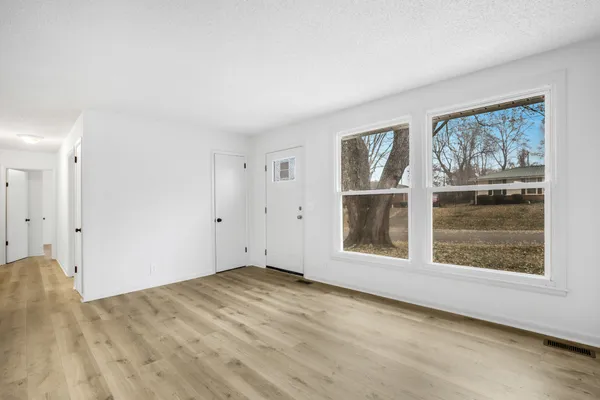 an empty room with windows