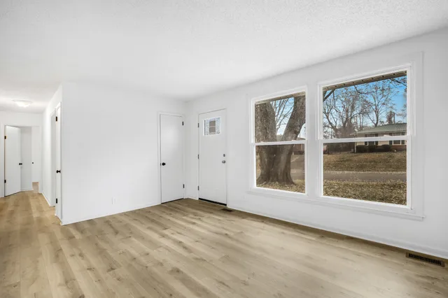 an empty room with windows