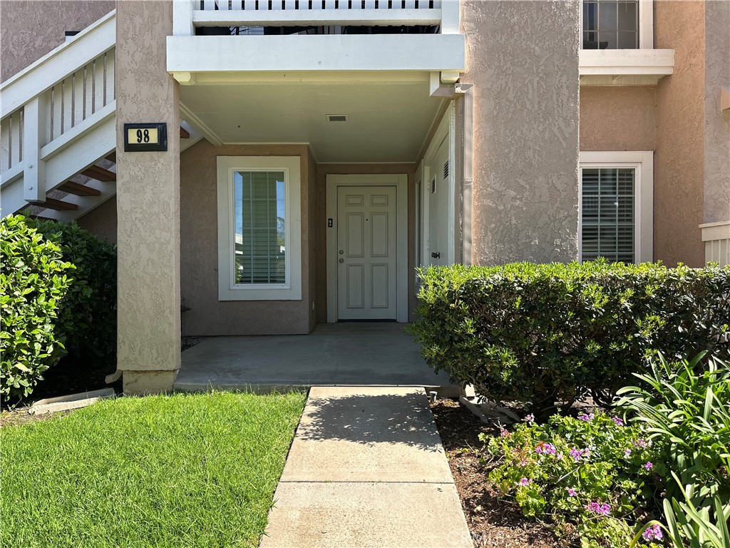 a view of a brick house with a yard