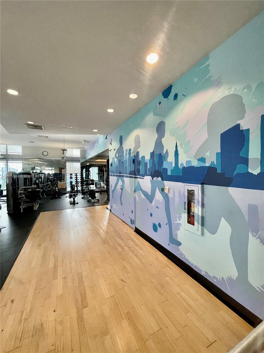 79 Southwest 12th Street, Unit 2407S Miami, FL 33130 - Photo 30 of 35 a view of living room with furniture and view of large mirror