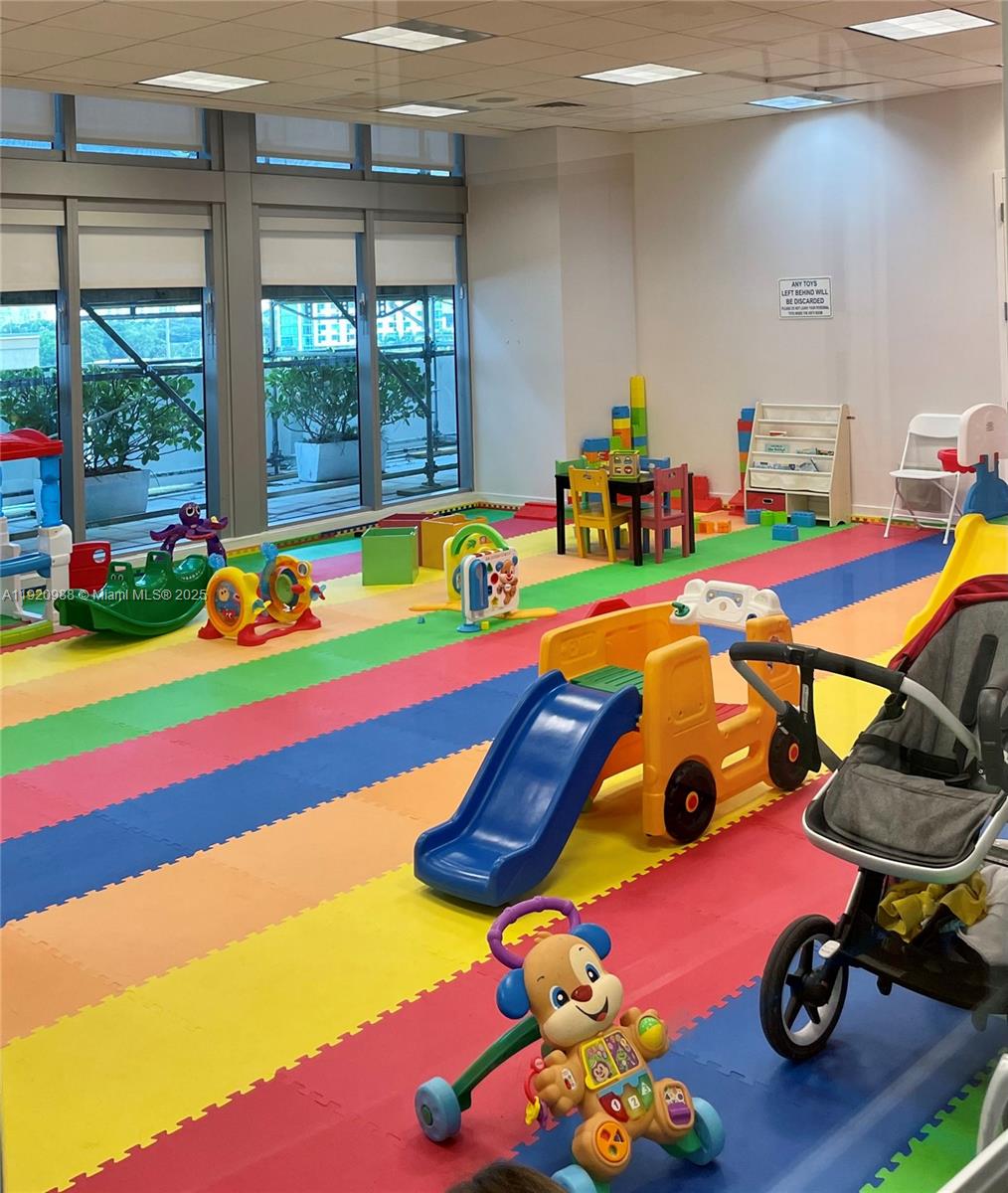 79 Southwest 12th Street, Unit 2407S Miami, FL 33130 - Photo 34 of 35 a room with toys and wooden floor