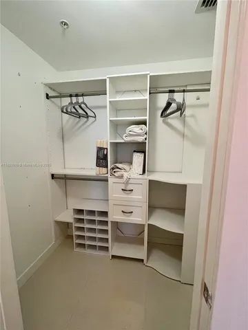 a view of an empty walk in closet