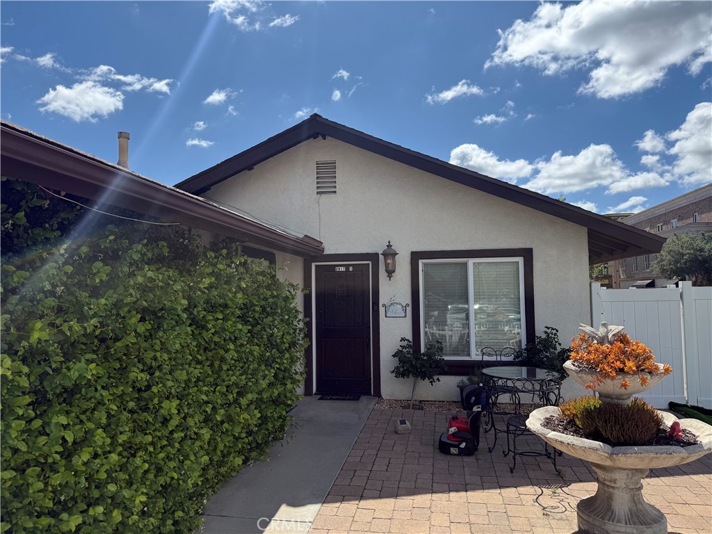 41880 6th Street Temecula, CA 92590 - Photo 2 of 8 a front view of a house with garden