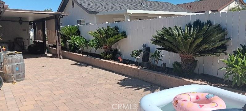 41880 6th Street Temecula, CA 92590 - Photo 6 of 8 a potted plant sitting in front of a building