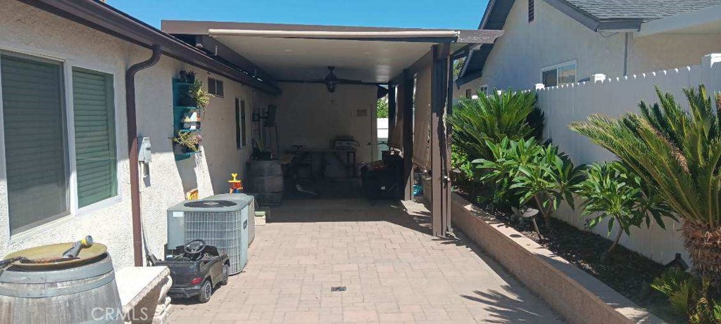 41880 6th Street Temecula, CA 92590 - Photo 7 of 8 a potted plant sitting in front of a house