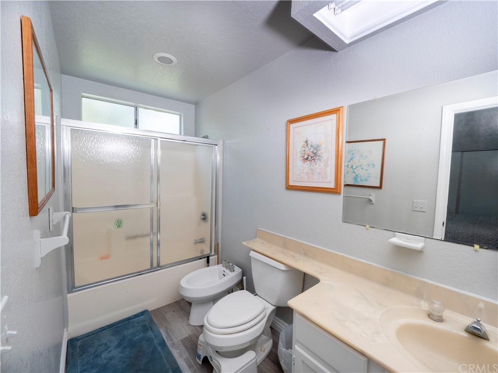 33881 Orilla Road Dana Point, CA 92629 - Photo 20 of 37 a bathroom with a sink a toilet and shower