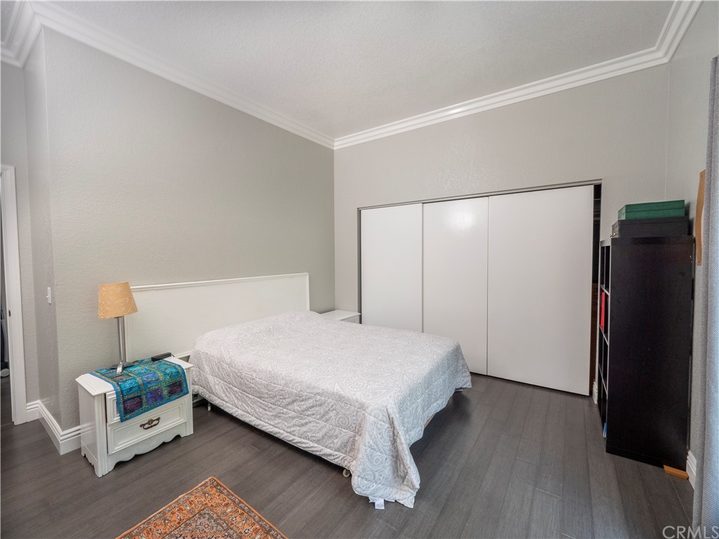 33881 Orilla Road Dana Point, CA 92629 - Photo 21 of 37 a bedroom with a bed and a mirror