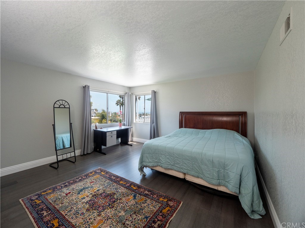 33881 Orilla Road Dana Point, CA 92629 - Photo 33 of 37 a bedroom with a bed and a dresser next to a window