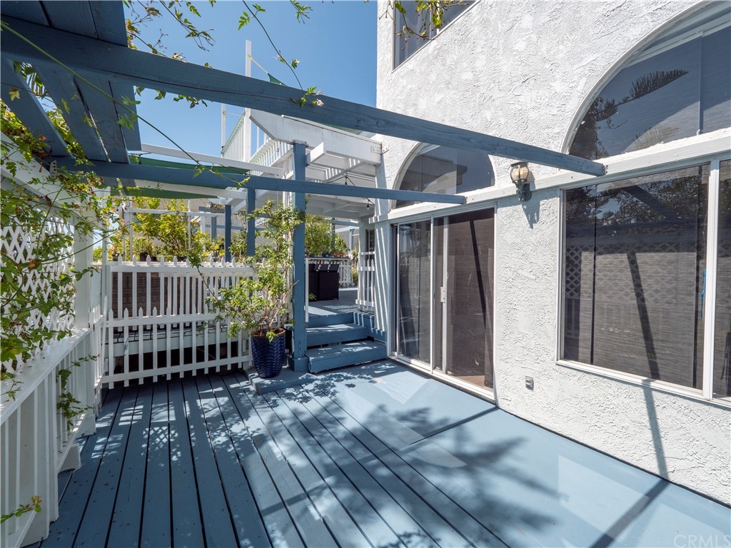 33881 Orilla Road Dana Point, CA 92629 - Photo 9 of 37 a view of porch with two chairs and wooden floor