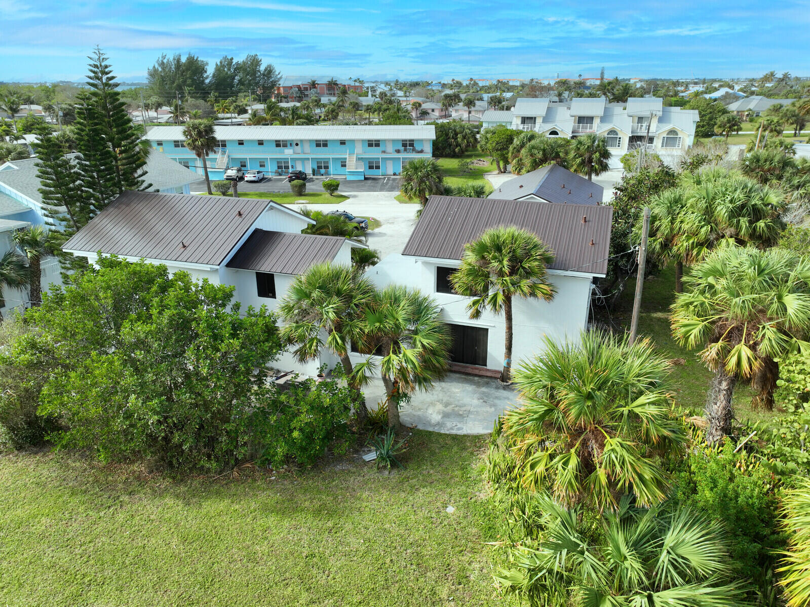 652 Hernando Street, Unit E Fort Pierce, FL 34949 - Photo 7 of 21 an aerial view of residential houses with outdoor space and trees