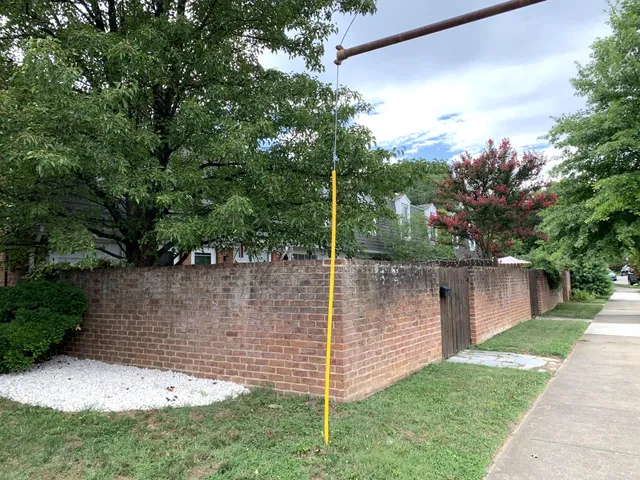 a view of a wooden house with a yard