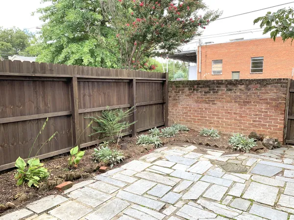 a backyard of a house with plants