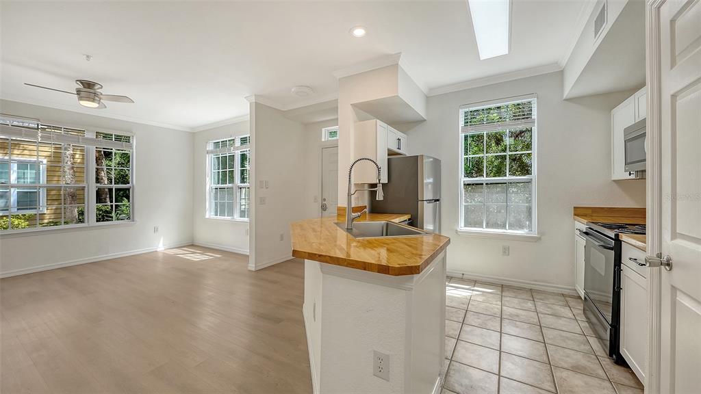 5561 Rosehill Road, Unit 104 Sarasota, FL 34233 - Photo 14 of 53 a living room with furniture and a window
