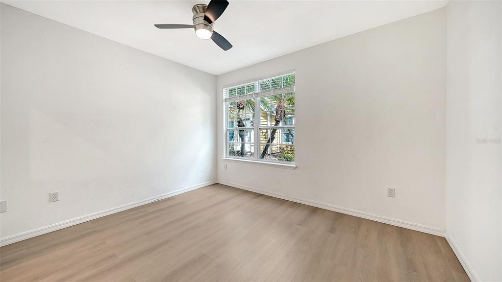 5561 Rosehill Road, Unit 104 Sarasota, FL 34233 - Photo 19 of 53 a view of an empty room with a window