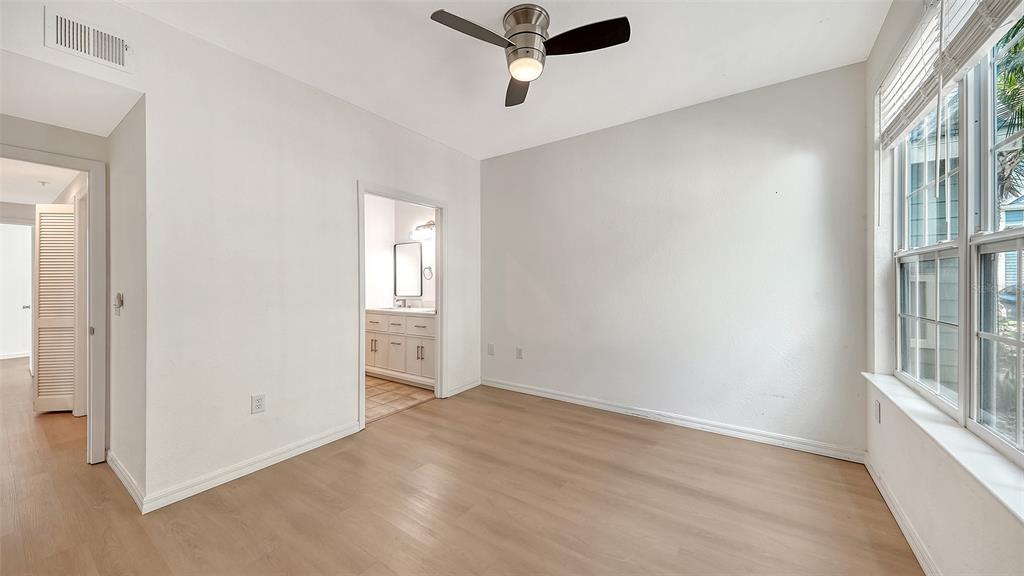 5561 Rosehill Road, Unit 104 Sarasota, FL 34233 - Photo 20 of 53 an empty room with windows and closet