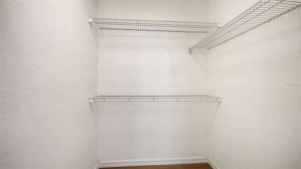 5561 Rosehill Road, Unit 104 Sarasota, FL 34233 - Photo 24 of 53 a view of a room with racks on the wall