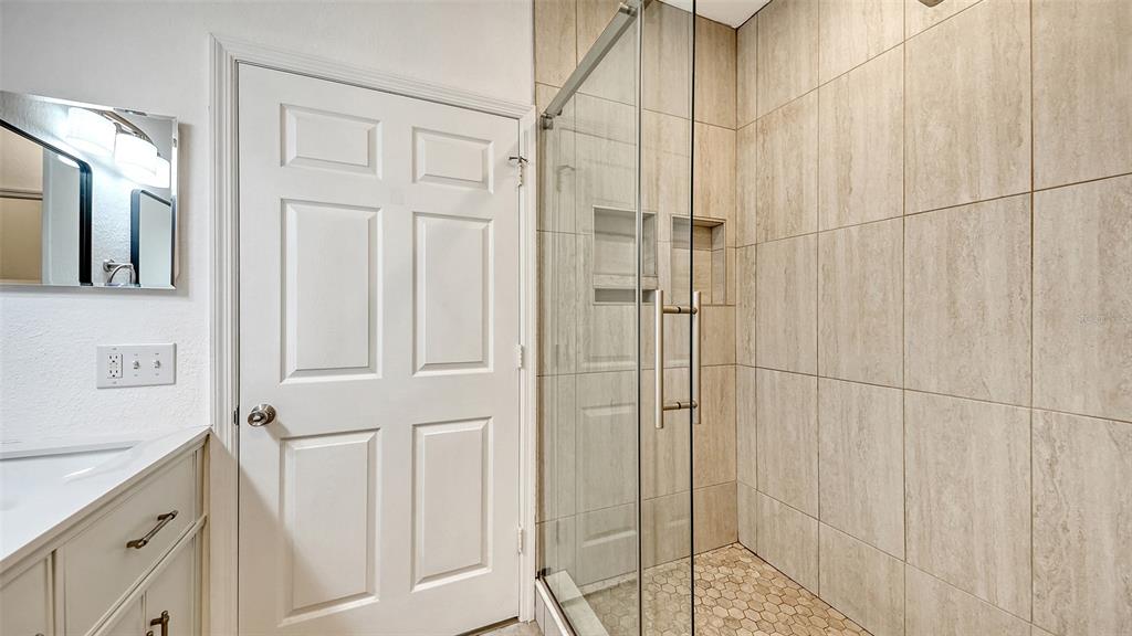 5561 Rosehill Road, Unit 104 Sarasota, FL 34233 - Photo 25 of 53 a bathroom with a shower