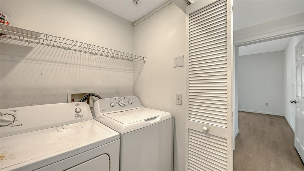 5561 Rosehill Road, Unit 104 Sarasota, FL 34233 - Photo 27 of 53 a utility room with dryer and washer