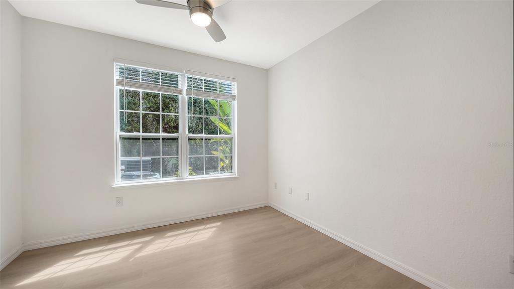 5561 Rosehill Road, Unit 104 Sarasota, FL 34233 - Photo 28 of 53 an empty room with a window