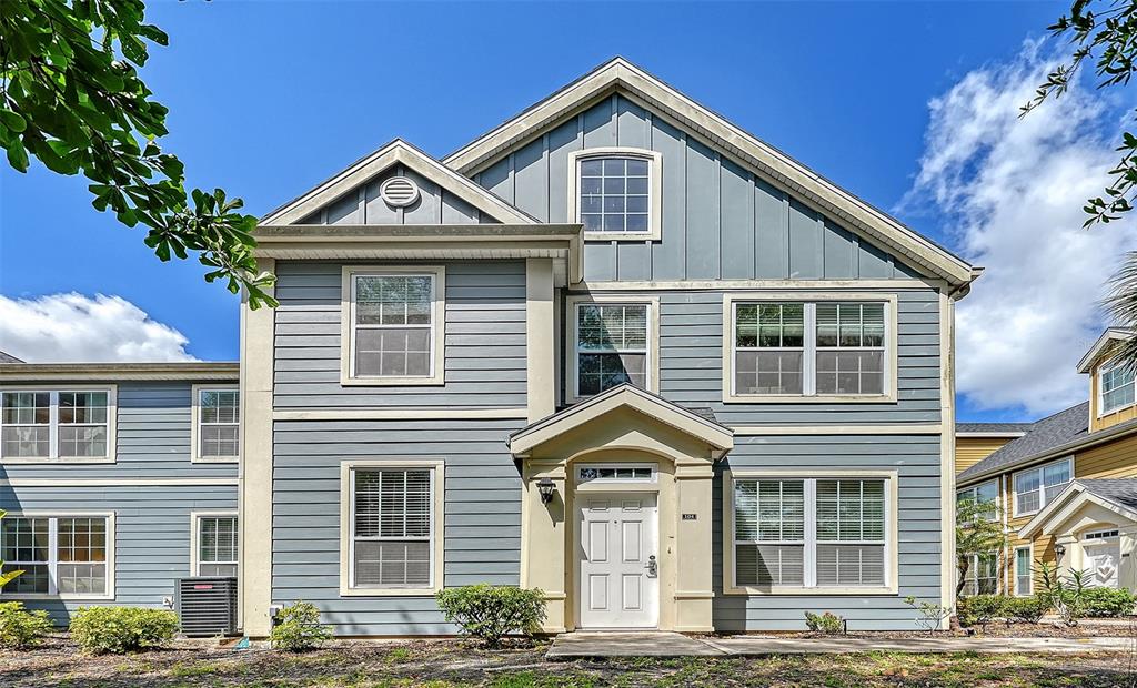 5561 Rosehill Road, Unit 104 Sarasota, FL 34233 - Photo 3 of 53 a front view of a house with a yard