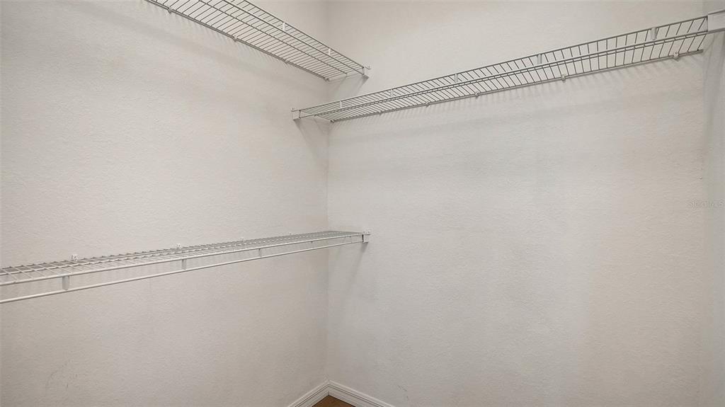 5561 Rosehill Road, Unit 104 Sarasota, FL 34233 - Photo 33 of 53 a view of a room with racks on the wall