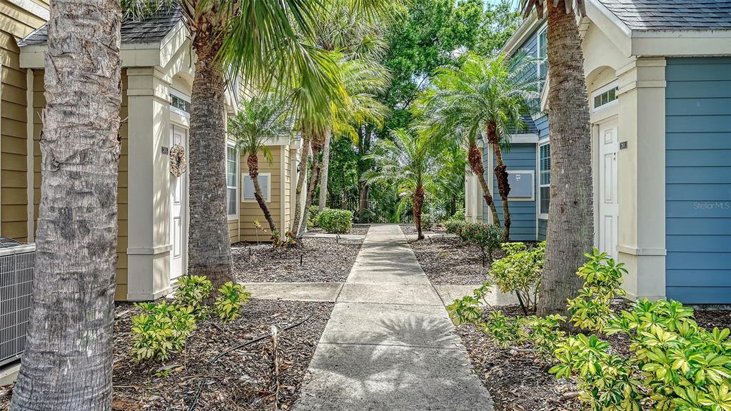 5561 Rosehill Road, Unit 104 Sarasota, FL 34233 - Photo 40 of 53 a view of a pathway both side of house